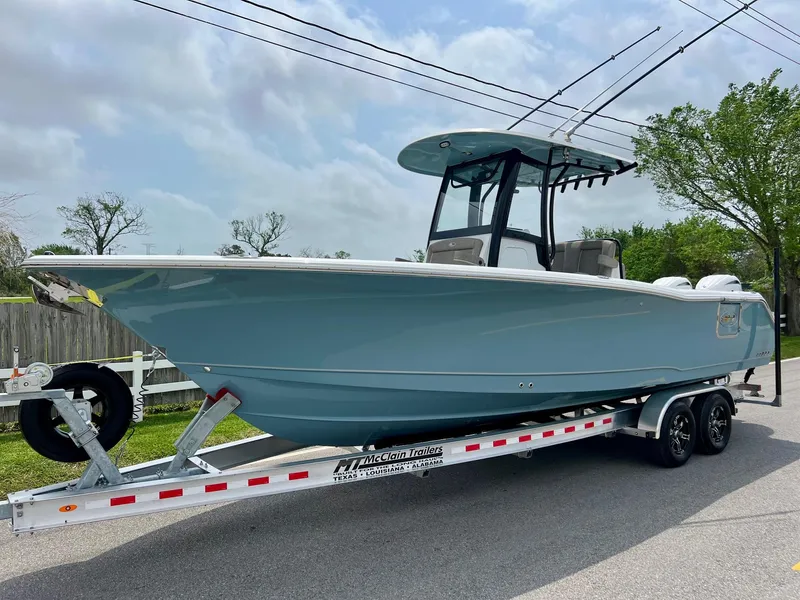 Slide: The Image of 2025 Sea Hunt Gamefish 27 with Coffin Box on trailer, parked outdoors. - 1