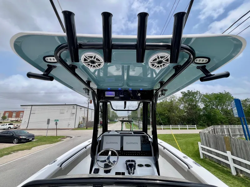 Slide: The Image of 2025 Sea Hunt Gamefish 27 boat interior with advanced navigation and fishing equipment. - 11