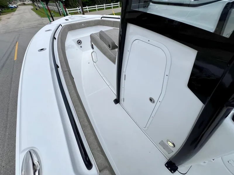 Slide: The Image of 2025 Sea Hunt Gamefish 27 boat deck with coffin box, featuring sleek design and spacious layout. - 12