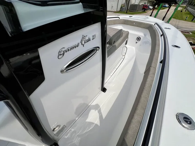 Slide: The Image of 2025 Sea Hunt Gamefish 27 with Coffin Box, sleek design, spacious deck, modern features. - 15