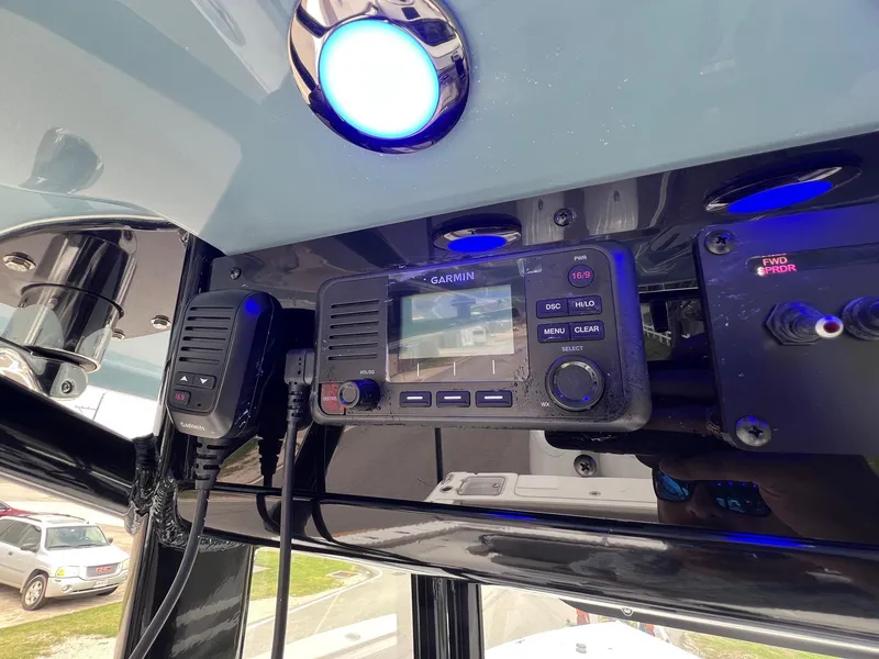 Slide: The Image of Control panel of 2025 Sea Hunt Gamefish 27 with Garmin electronics and blue LED light. - 18