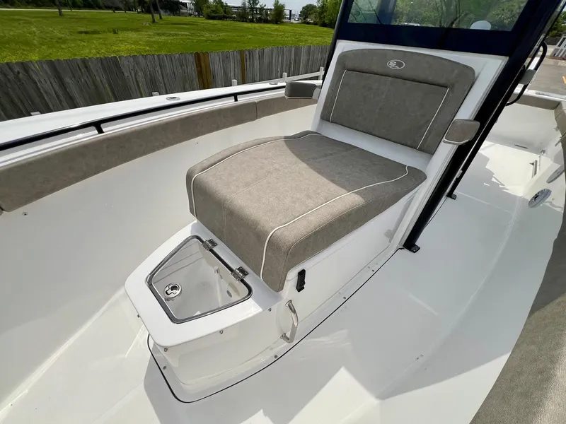 Slide: The Image of 2025 Sea Hunt Gamefish 27 with Coffin Box, featuring cushioned seating and sleek design. - 21