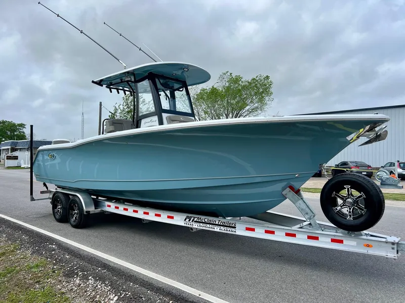 Slide: The Image of 2025 Sea Hunt Gamefish 27 with Coffin Box on trailer, parked outdoors. - 5