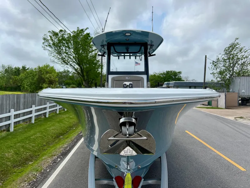 Slide: The Image of 2025 Sea Hunt Gamefish 27 with Coffin Box on road, front view, cloudy sky. - 6