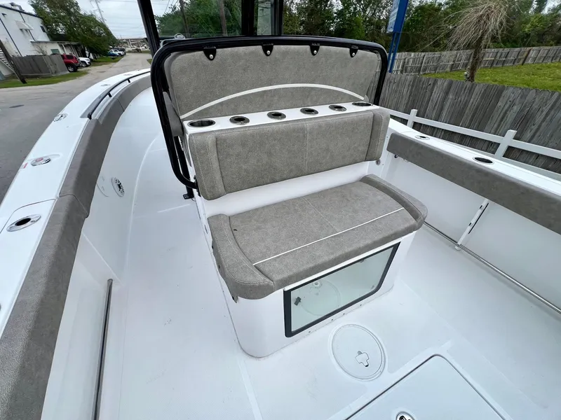 Slide: The Image of 2025 Sea Hunt Gamefish 27 with Coffin Box, featuring cushioned seating and rod holders. - 8