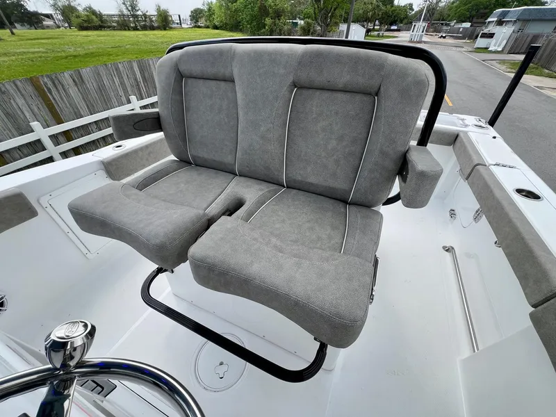 Slide: The Image of 2025 Sea Hunt Gamefish 27 boat seating with gray upholstery and armrests. - 9