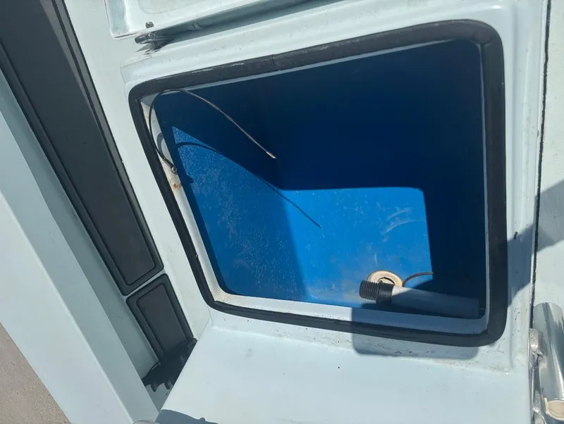 Slide: The Image of Open storage compartment in 2012 Beavertail Skiffs BT3 boat. - 13