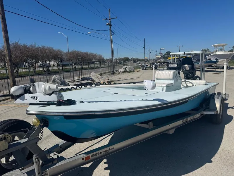 Slide: The Image of 2012 Beavertail Skiffs BT3 boat on trailer, parked outdoors under clear blue sky. - 3