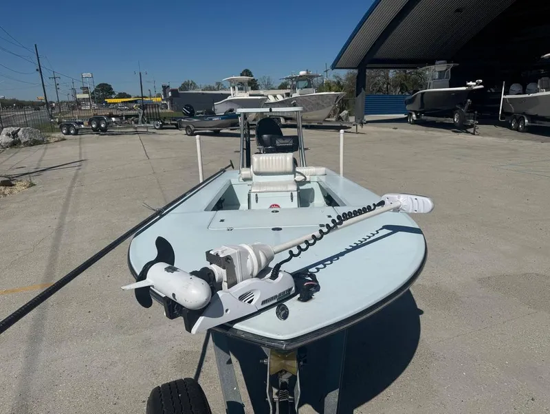 Slide: The Image of 2012 Beavertail Skiffs BT3 boat with trolling motor in a marina setting. - 4
