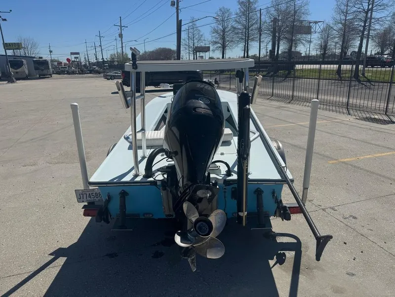 Slide: The Image of 2012 Beavertail Skiffs BT3 boat with outboard motor, parked in a lot. - 7