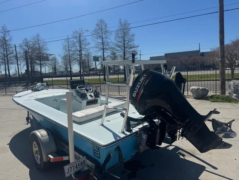 Slide: The Image of 2012 Beavertail Skiffs BT3 boat with Suzuki outboard motor on trailer. - 8