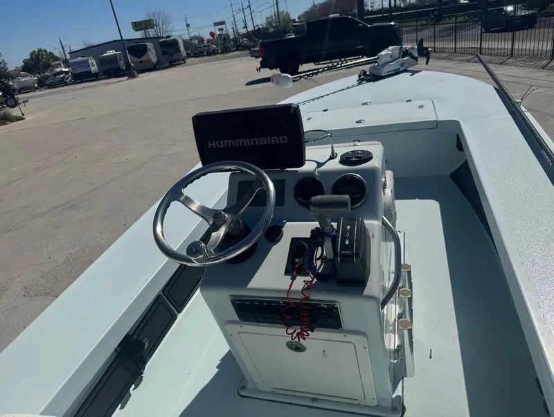 Slide: The Image of 2012 Beavertail Skiffs BT3 boat interior with steering wheel and Humminbird navigation system. - 9