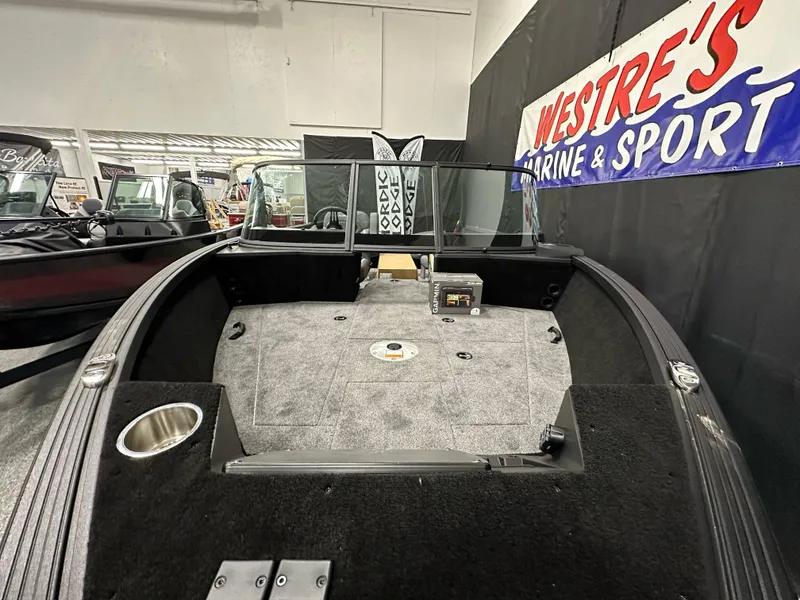 Slide: The Image of 2025 Alumacraft Competitor 185X Sport boat interior at Westre's Marine & Sport showroom. - 10