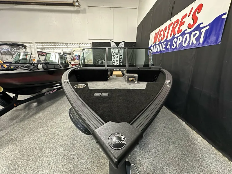 Slide: The Image of 2025 Alumacraft Competitor 185X Sport boat displayed at Westre's Marine & Sport showroom. - 9