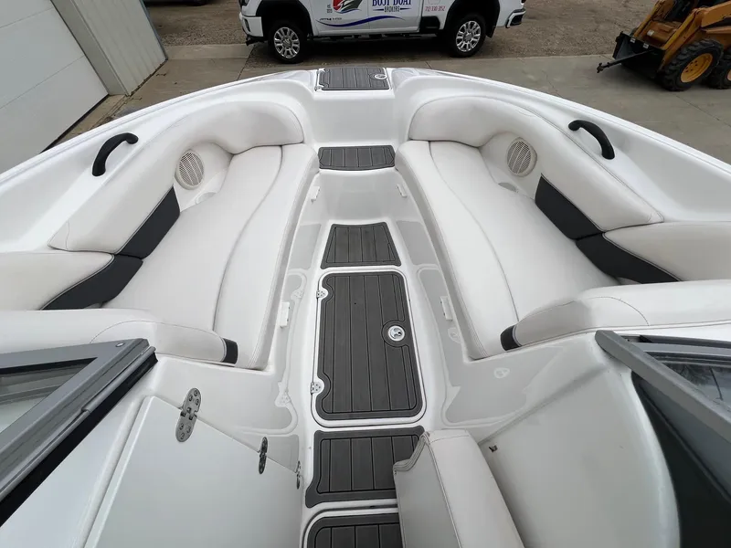 Slide: The Image of 2007 Yamaha Boats SX210 interior with white seating and black accents. - 11