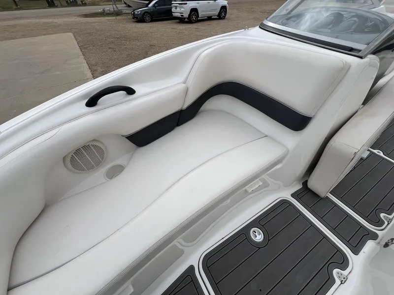 Slide: The Image of 2007 Yamaha Boats SX210 interior with white seating and black accents. - 13