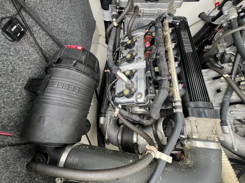 Slide: The Image of Engine compartment of a 2007 Yamaha Boats SX210, showcasing detailed components and wiring. - 22