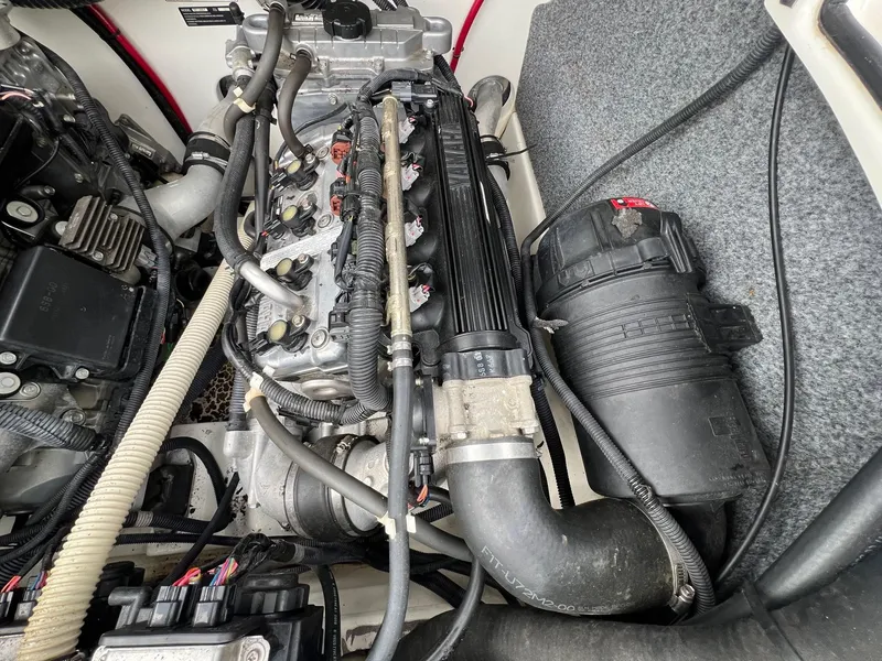 Slide: The Image of Engine compartment of a 2007 Yamaha Boats SX210, showcasing detailed components and wiring. - 23