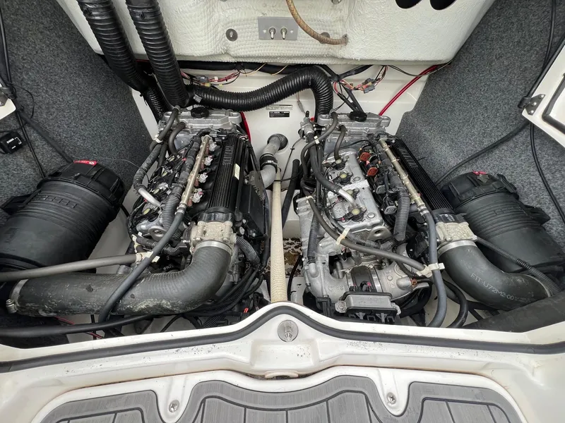 Slide: The Image of 2007 Yamaha Boats SX210 engine compartment with dual engines and wiring. - 24