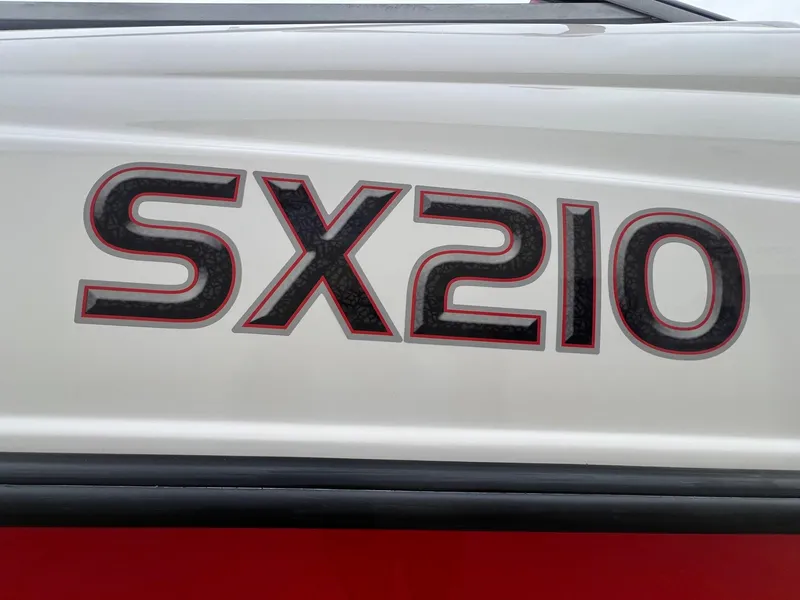 Slide: The Image of 2007 Yamaha Boats SX210 logo on white and red boat exterior. - 5