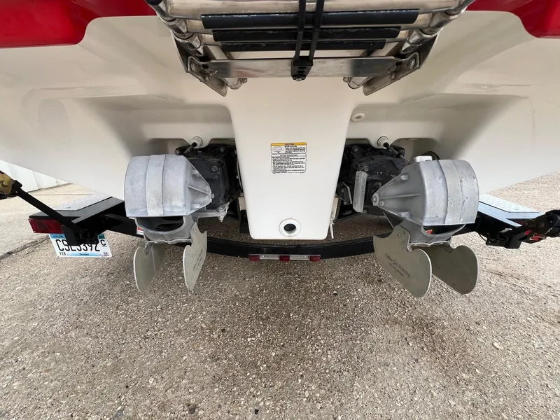 Slide: The Image of Rear view of a 2007 Yamaha SX210 boat showing dual propellers and trailer. - 6