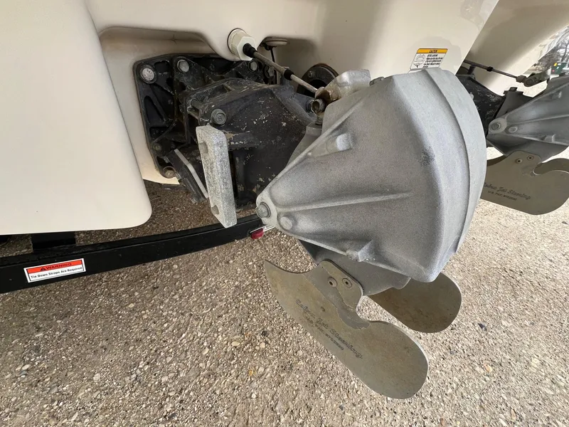 Slide: The Image of Close-up of 2007 Yamaha SX210 boat's jet drive system on a gravel surface. - 7