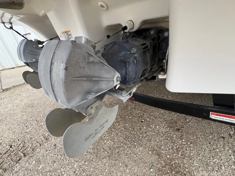 Slide: The Image of 2007 Yamaha SX210 boat engine and propeller detail on concrete surface. - 8