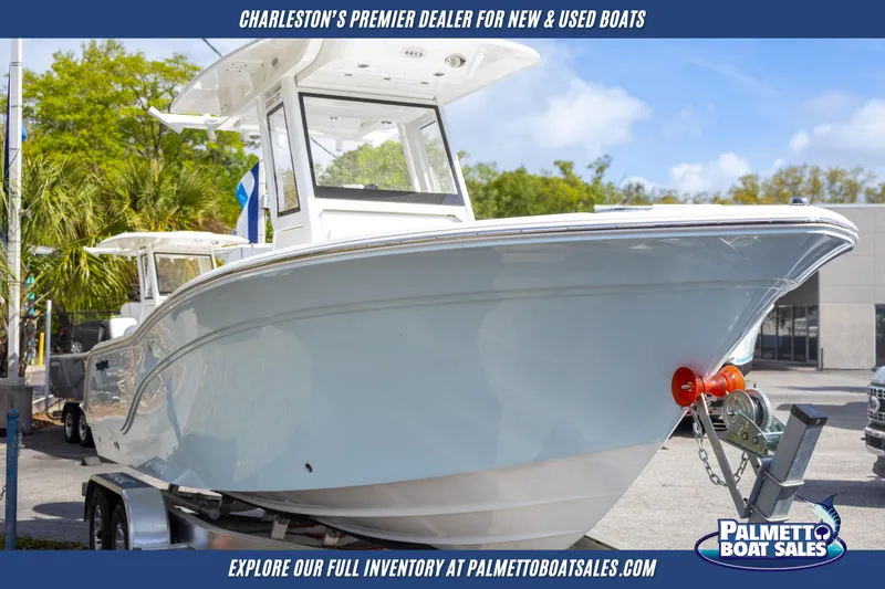 Slide: The Image of 2025 Sea Fox 228 Commander boat displayed at Palmetto Boat Sales dealership. - 1