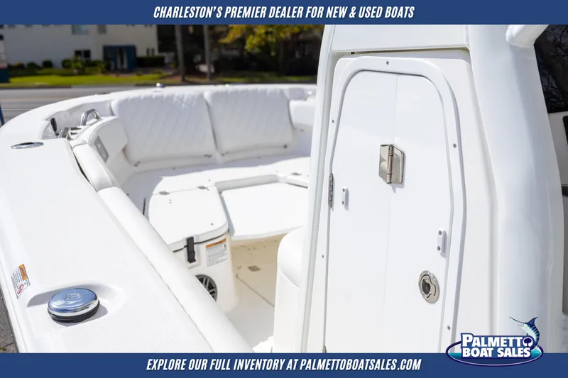 Slide: The Image of 2025 Sea Fox 228 Commander boat interior with white seating, showcased by Palmetto Boat Sales. - 10