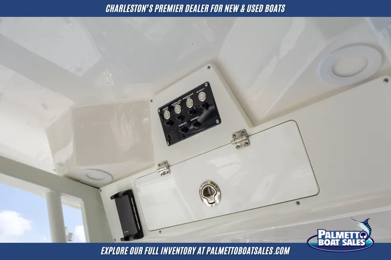 Slide: The Image of 2025 Sea Fox 228 Commander boat interior with control panel, showcased by Palmetto Boat Sales. - 12