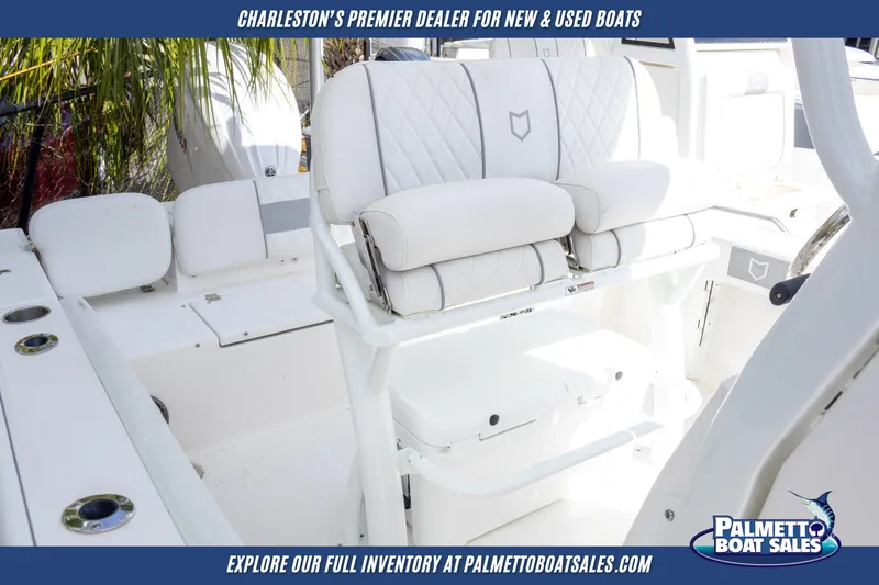 Slide: The Image of 2025 Sea Fox 228 Commander boat interior with white seating, showcased by Palmetto Boat Sales. - 16