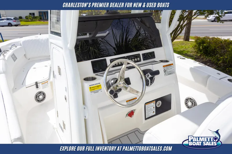 Slide: The Image of 2025 Sea Fox 228 Commander boat interior with steering wheel and controls. - 18