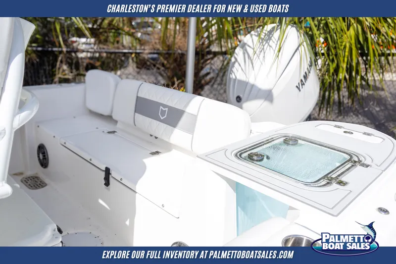 Slide: The Image of 2025 Sea Fox 228 Commander boat interior with seating and Yamaha engine, at Palmetto Boat Sales. - 7
