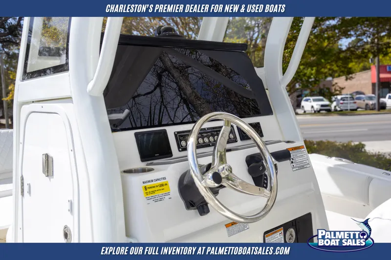 Slide: The Image of 2025 Sea Fox 228 Commander boat console with steering wheel and controls. - 9