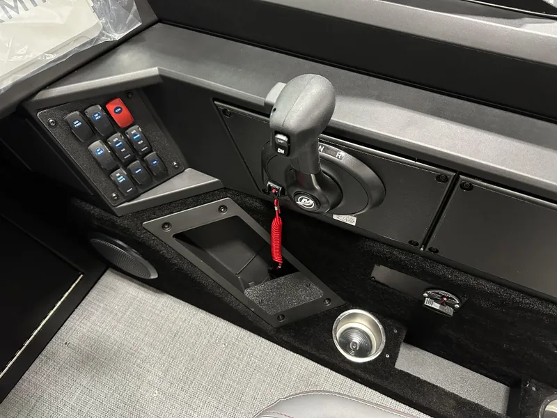 Slide: The Image of Control panel of 2025 Alumacraft Competitor 185X Sport boat with throttle and switches. - 14