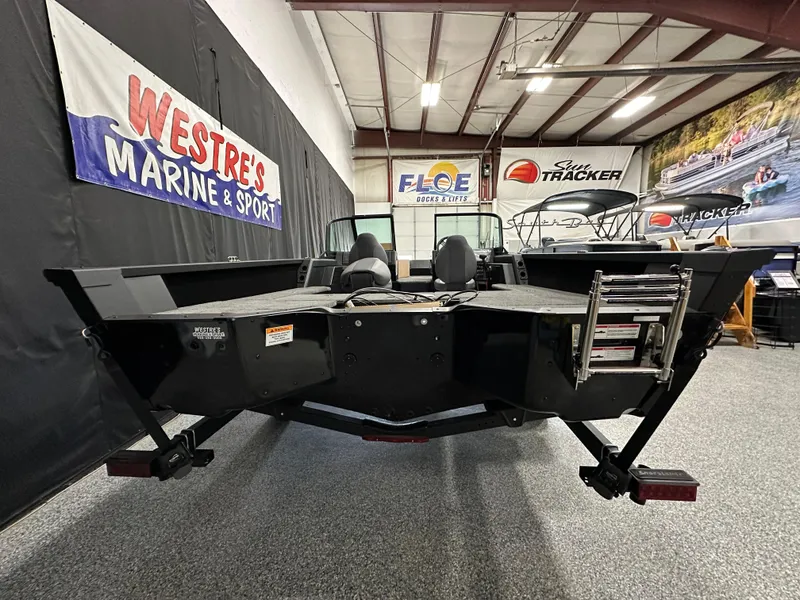 Slide: The Image of 2025 Alumacraft Competitor 185X Sport boat displayed at Westre's Marine & Sport showroom. - 3