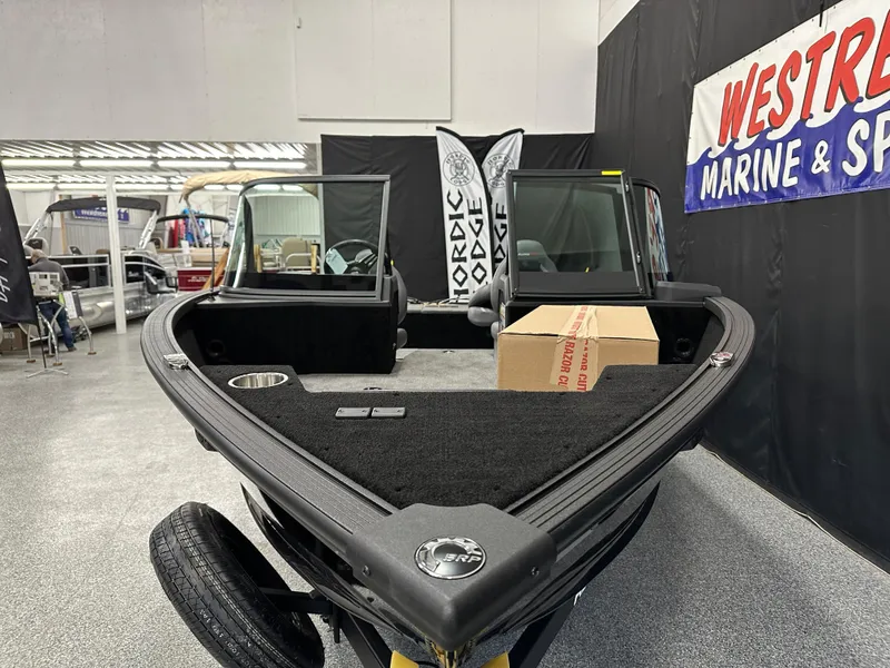 Slide: The Image of 2025 Alumacraft Competitor 185X Sport boat displayed at Westrac Marine & Sport showroom. - 5