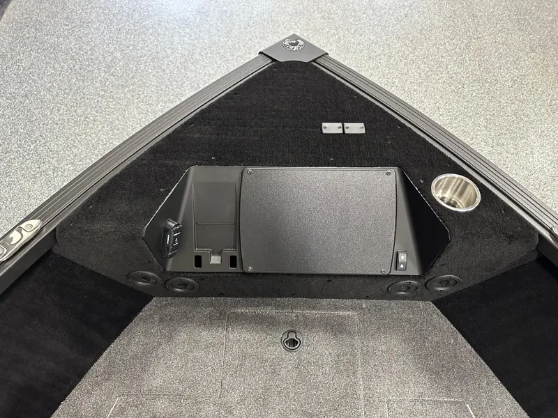 Slide: The Image of 2025 Alumacraft Competitor 185X Sport boat interior with storage and cup holder. - 6