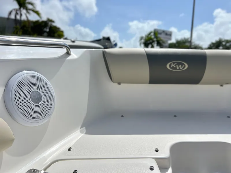 Slide: The Image of 2025 Key West 203 DFS boat interior with speaker and KW logo on seat. - 14