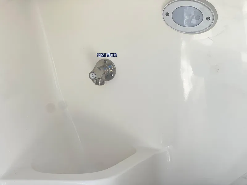Slide: The Image of Fresh water outlet on 2025 Key West 203 DFS boat interior. - 19