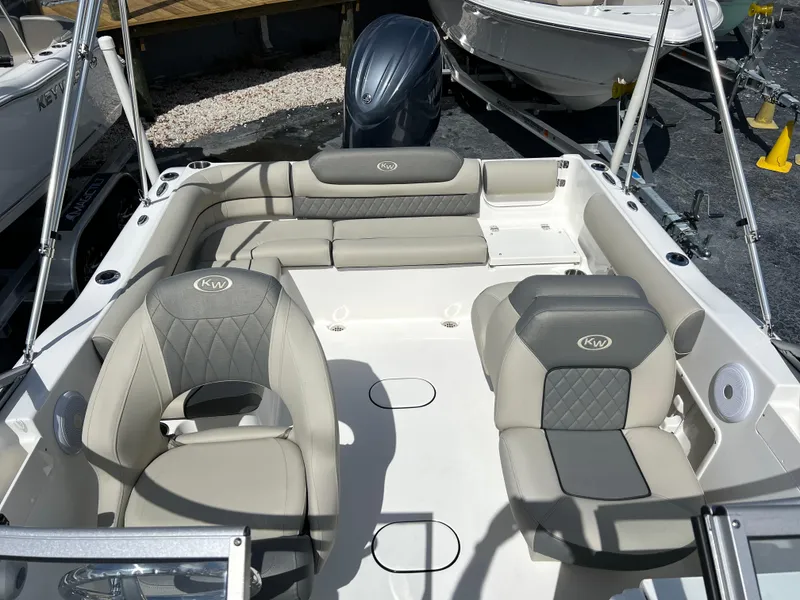 Slide: The Image of 2025 Key West 203 DFS boat interior with cushioned seating and modern design. - 23