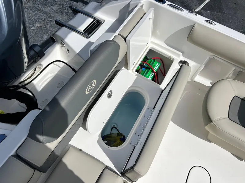 Slide: The Image of 2025 Key West 203 DFS boat interior with storage compartments and seating. - 26
