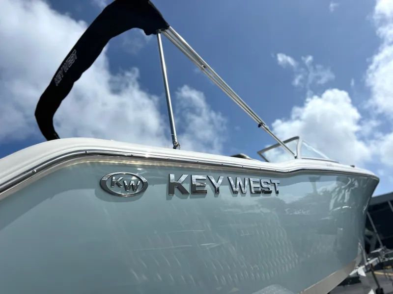 Slide: The Image of 2025 Key West 203 DFS boat under a clear blue sky. - 5