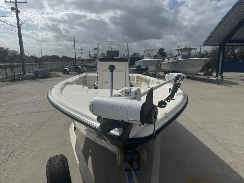 Slide: The Image of 2007 Triton 240 LTS boat on trailer, parked outdoors under cloudy sky. - 3