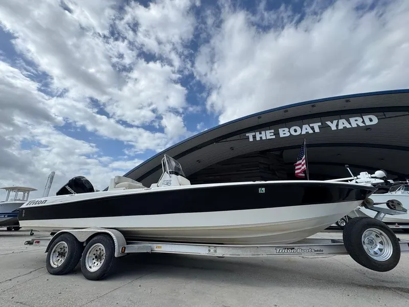 Slide: The Image of 2007 Triton 240 LTS boat on trailer at The Boat Yard under cloudy sky. - 5