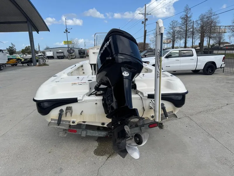 Slide: The Image of 2007 Triton 240 LTS boat with outboard motor on trailer in parking lot. - 7