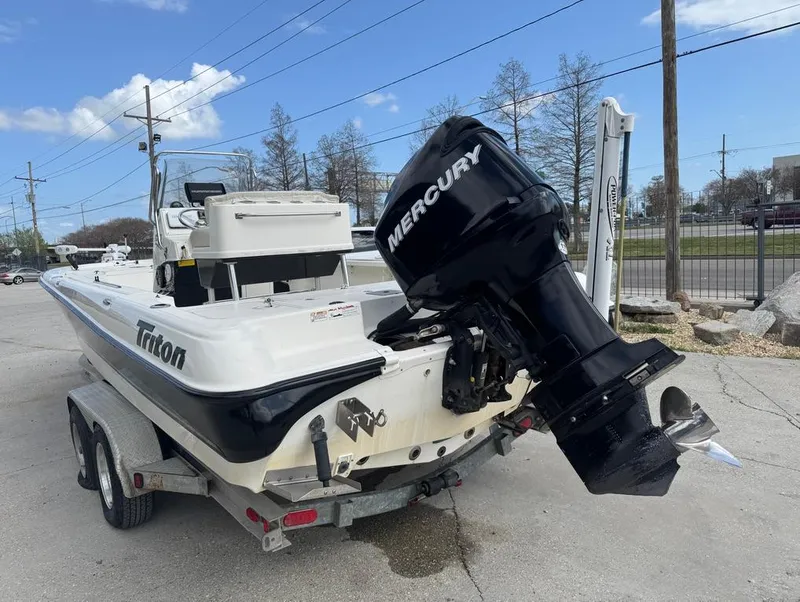 Slide: The Image of 2007 Triton 240 LTS boat with Mercury outboard motor on trailer. - 8