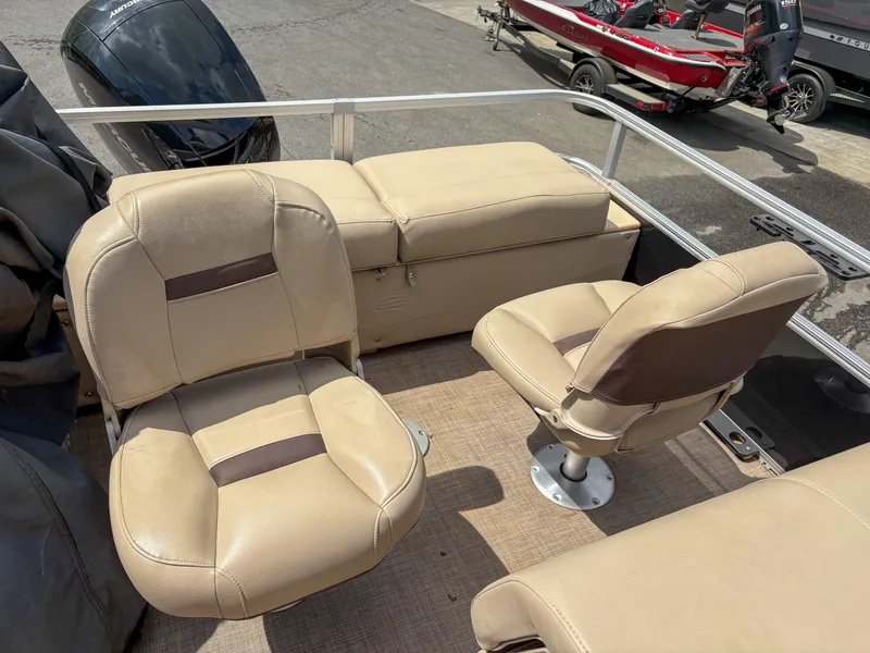 Slide: The Image of 2019 Sun Tracker Fishin Barge 24 DLX with beige seating and spacious deck layout. - 12