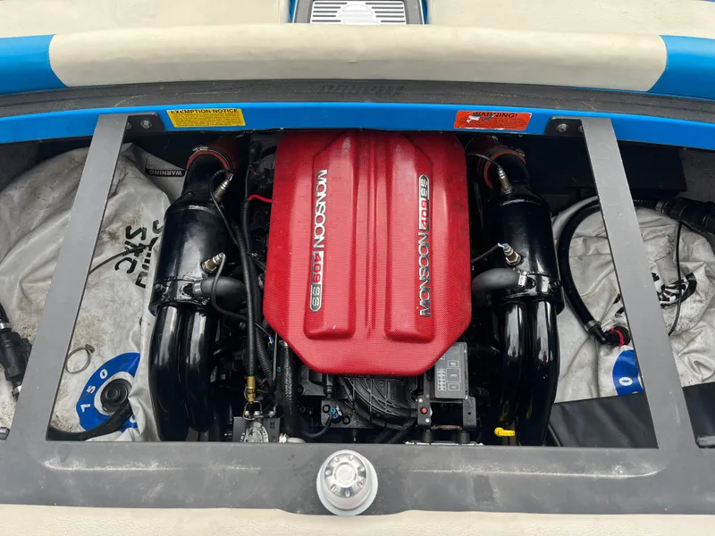 Slide: The Image of 2014 Malibu Wakesetter 24 MXZ engine compartment with Monsoon 409 engine. - 2