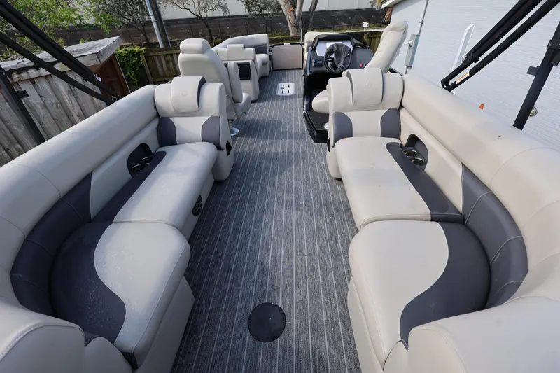 Slide: The Image of 2023 Premier 250 SunSation RF pontoon boat with spacious seating and modern interior design. - 8